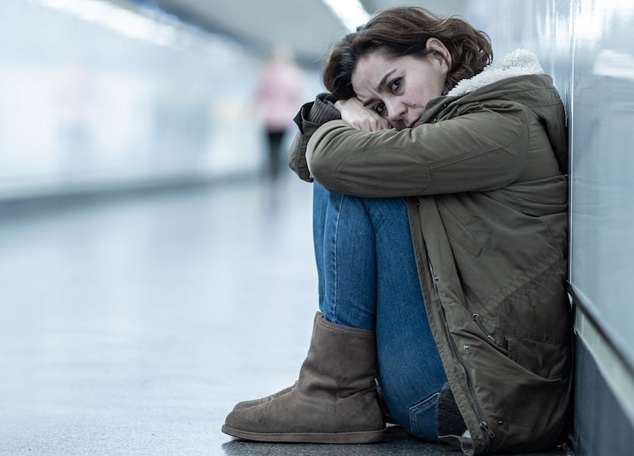 depressed woman in tunnel